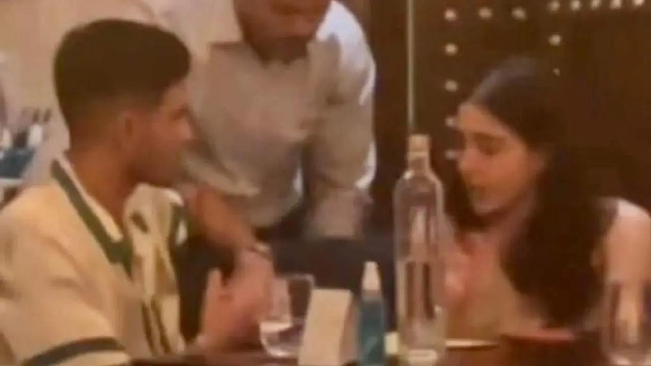 A blurry picture clicked from a distance of Sara and Shubham interacting with a waiter at a restaurant has gone viral on social media. Read full story here